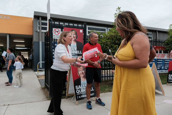 Labor candidate for Camden Sally Quinnell handing out at Spring Farm Public School, with upper house MP Mark Buttigieg.