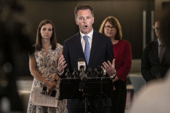 Premier Chris Minns, with Courtney Houssos and Donna Davis in the background.  