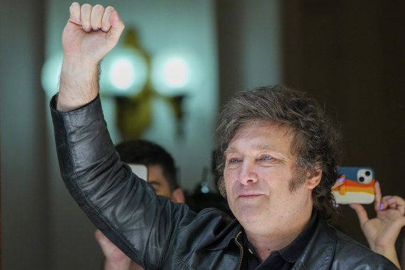 Javier Milei raises his fist after voting.