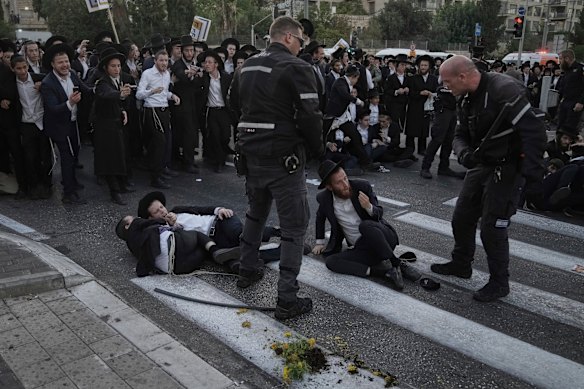 Police disperse ultra-Orthodox Jews blocking a road during a protest against army recruitment in Jerusalem this month.