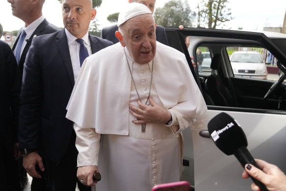 Pope Francis talks with journalists as he leaves the Agostino Gemelli University Hospital in Rome on Saturday.