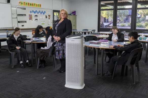 Scoresby Secondary College principal Gail Major pictured with students in April 2022.