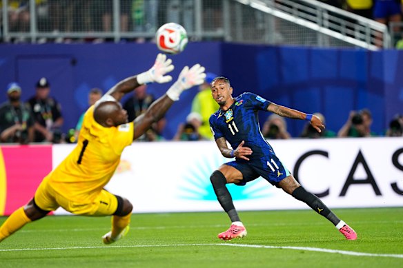 Brazil’s Raphinha makes an attempt to score against Haiti goalkeeper Johny Placide.