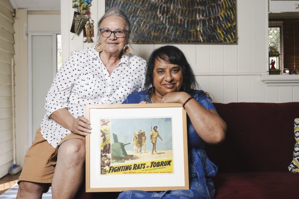 Black Rat of Tobruk Archibald Driscoll’s daughter-in-law Colleen Hurley and granddaughter Angelina Hurley with the movie poster he features in.