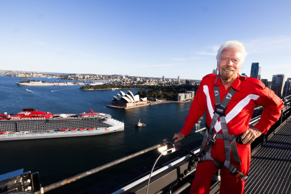 Branson welcomes his $1.1 billion ship, Resilient Lady, from the top of the Sydney Harbour Bridge.
