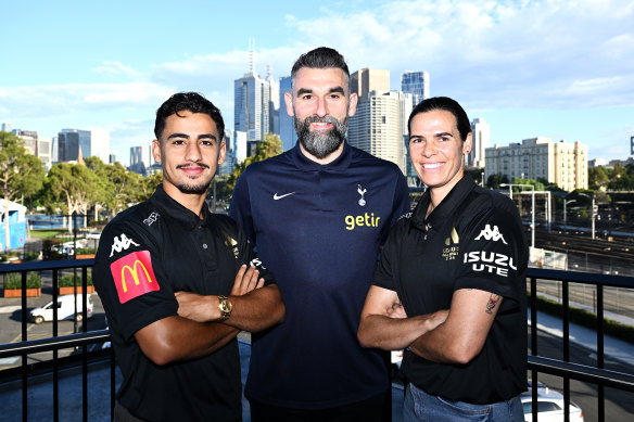 Former Socceroos captain Mile Jedinak (centre), now supporting Ange Postecoglou at Tottenham Hotspur, joined Melbourne Victory players Daniel Arzani and Lydia Williams to promote a three-match series of soccer games that will be played in Melbourne in May.
