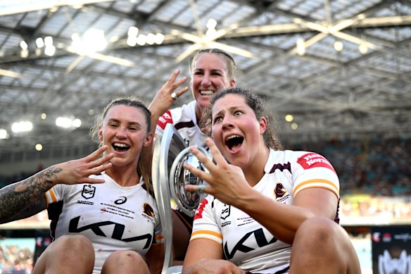 Broncos players Julia Robinson, Ali Brigginshaw and Chelsea Lenarduzzi after winning the 2025 NRLW grand final against the Roosters.