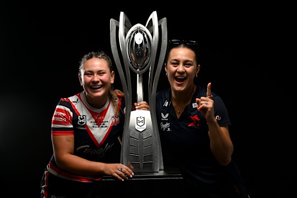 Keeley Davis and Corban Baxter with the 2024 NRLW premiership trophy.