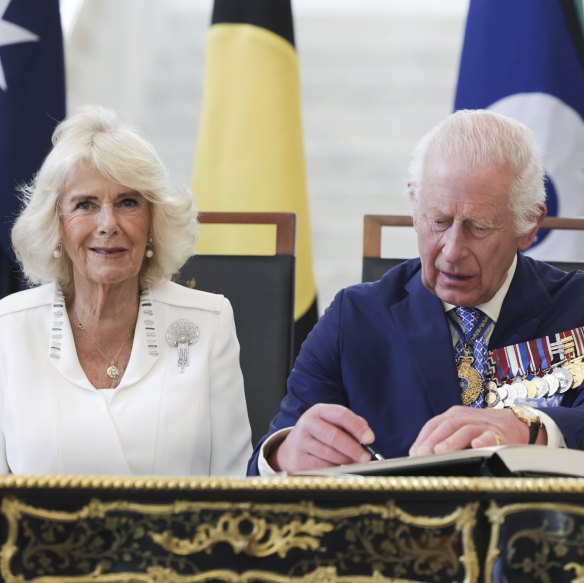 TM King Charles and Queen Camilla signing the visitor’s book in Parliament House, Canberra