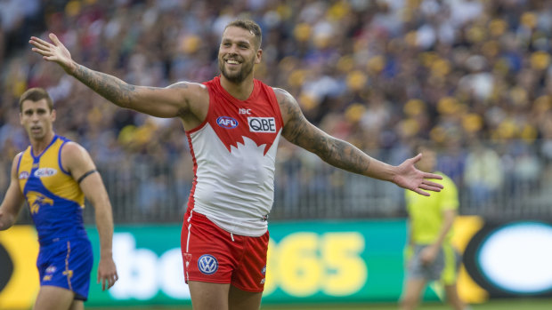 Winning grin: Lance Franklin celebrates another major score for the Swans.