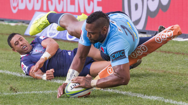 Inside the chalk: Taqele Naiyaravoro adds to the Rebels' pain with another try.