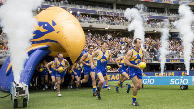 New nest: Eagle's captain Shannon Hurn leads his team onto the Perth Stadium ground.