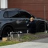 NSW police collect evidence at 31 Mary Wade Place in Carnes Hill which is now a crime scene after a 25 year old male was shot twice during a targeted home invasion by eight masked people.  A vehicle in the driveway was also damaged. 