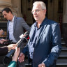 I Cook Foods owner Ian Cook (centre) outside the Supreme Court.