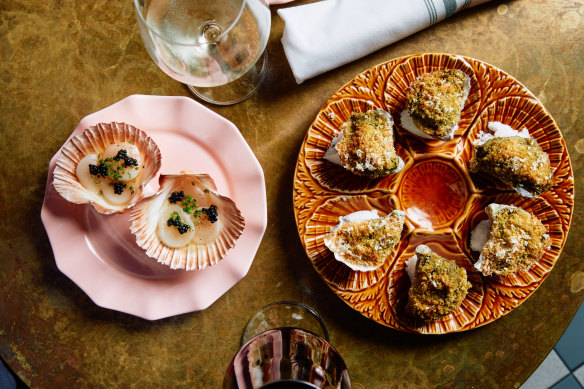 Scallops (left) and baked oysters at Poodle.