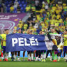 Brazil’s players in Qatar unveil a banner in support of Pele after their 4-1 round-of-16 win over South Korea.