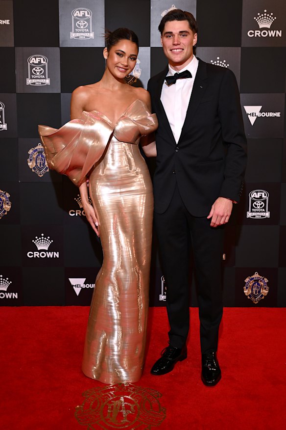 Sam Durham of the Essendon Bombers and partner Paris Bishop.