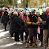 Queues of people stream into the MCG for Neale Daniher’s state funeral service.