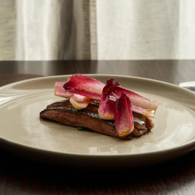 Dry-aged duck with witlof and mandarin dressing.