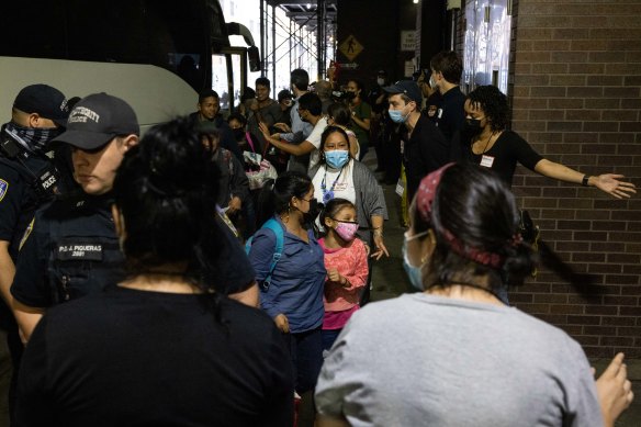 A bus carrying migrants from Texas arrives at Port Authority Bus Terminal.