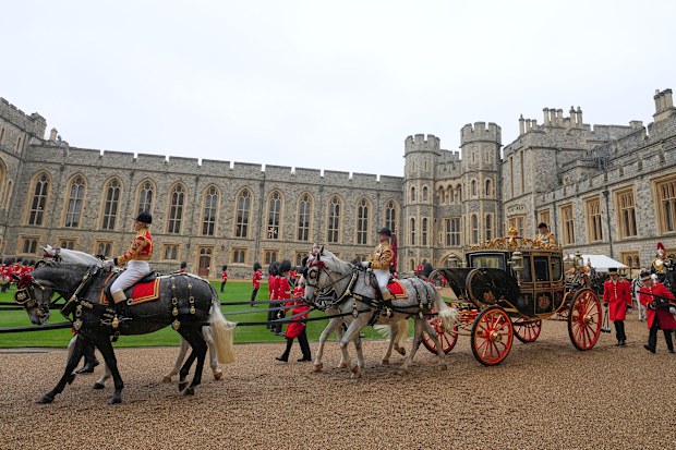 A carriage leaves after the Sultan of Oman, Haitham bin Tarik, and Britain’s King Charles III reviewed the Guard of Honour at Windsor Castle in Windsor, England, Tuesday, Oct. 20, 2026.