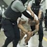 A man identified by Jennifer Vasquez Sura as her husband, Kilmar Abrego Garcia, is led by force by guards through the Terrorism Confinement Centre in Tecoluca, El Salvador in an undated photo.
