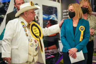 Alan ‘Howling Laud’ Hope, Official Monster Raving Loony Party, congratulates North Shropshire by-election winner Helen Morgan of the Liberal Democrats in Shrewsbury, England, on Friday.