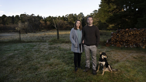 Emma Foley and Josh Taylor on the spot where they had hoped to build a granny flat, before their builder went bust and disappeared.
