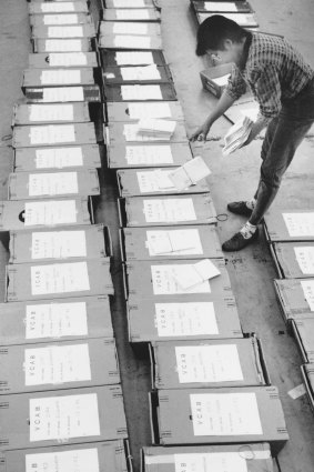 At the State Mail Centre in South Melbourne, Elvie Antonio sorts VCE results that will be delivered to students in 1992.