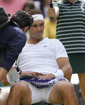 Rafael Nadal withdrew from his Wimbledon semi-final with an abdominal injury.