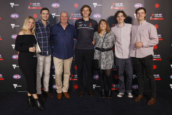 Aaron Cadman at Marvel Stadium with his family. 