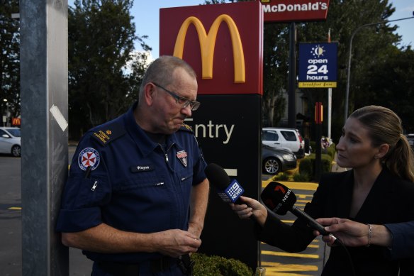 Liverpool-based paramedic Wayne Havenaar pays his respects to his colleague who was fatally stabbed in a car park at a McDonald’s in Campbelltown. 