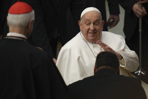 Pope Francis salutes faithful during his weekly general audience at the Vatican on February 12.