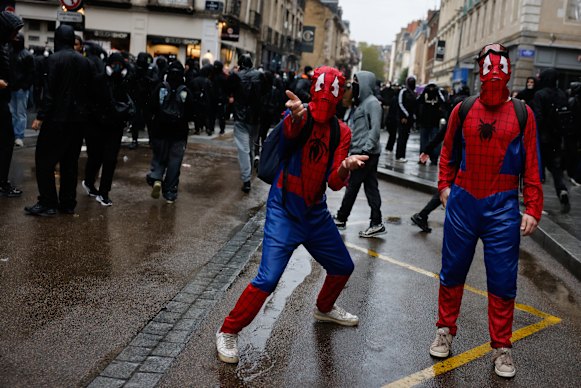 Protesters dressed as Spider-Man attend a demonstration against rising living costs in Rennes, France.