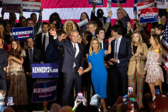 Robert F Kennedy jnr and his wife, actress Cheryl Hines, wave to supporters on stage after announcing his candidacy for president on April 19, 2023, in Boston, Massachusetts. 