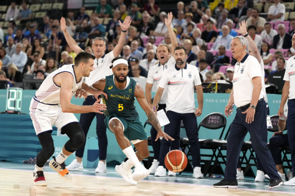 Australia’s Patty Mills takes it up to Serbian Aleksa Avramovic. 