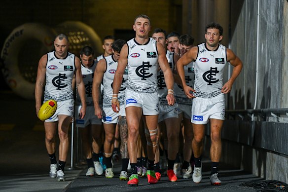 Patrick Cripps of the Blues leads his team out.