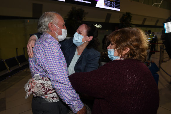 Barbara and Graham Bowman greet their daughter Elizabeth who arrived in Perth from London via Singapore. It has been two years since they have seen her.