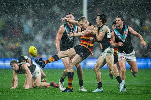 Great weather for ducks: Reilly O’Brien gets a kick away.