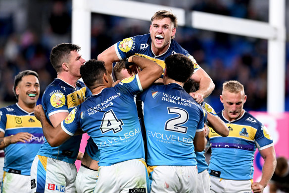 The Gold Coast Titans celebrate a big win over the Sea Eagles.