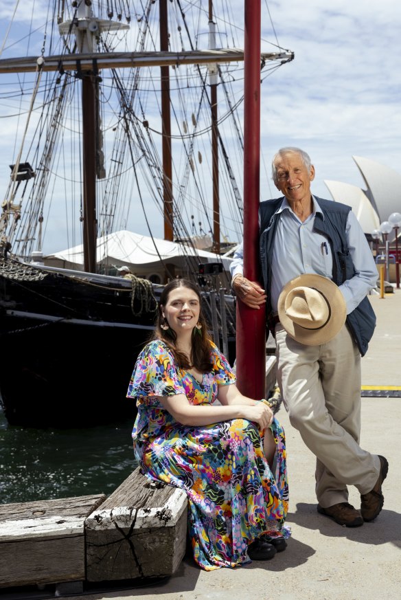 Madison Fazio and Jonathan King in front of the replica of the First Fleet ship Southern Swan at Circular Quay.