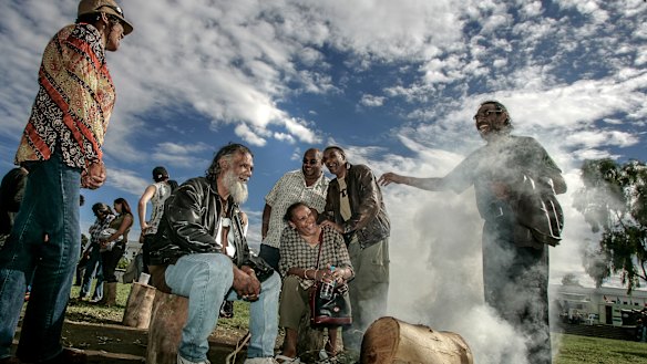 The Edwards family at the smoking fire before the 2008 apology. From left, Maria, Reg, Alice, Kutcha, Dave and Mick.