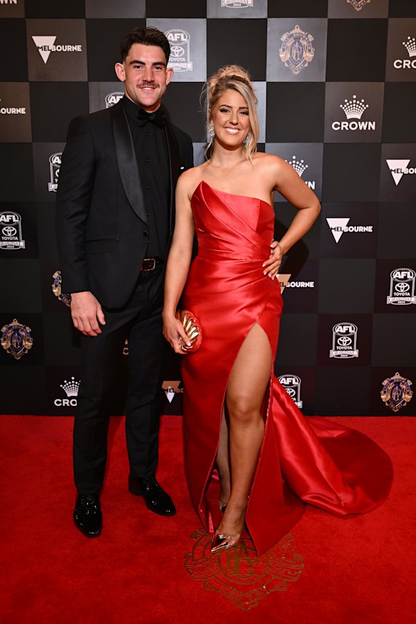 Jai Newcombe of the Hawthorn Hawks and partner Georgia May.