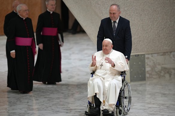 The pontiff arrives at the Pope Paul VI Hall at the Vatican for his weekly general audience on February 12, 2025.