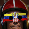 An anti-government protester wears Venezuelan flag motif sunglasses during a demonstration demanding the resignation of President Nicolas Maduro, in Caracas on  Saturday.