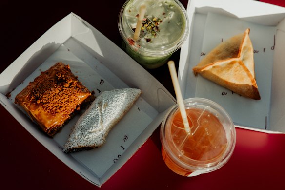 Iced yensoon tea, iced plum pistachio matcha, date shortbread, spinach triangle, and Biscoff baklava at Ard.