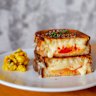 Three-cheese toastie with warrigal greens, kimchi and tomato.