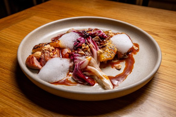 Duck breast with radicchio, orange, sauce bigarade and yuzu foam.