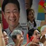 Incumbent Prime Minister Lawrence Wong celebrates the win.