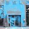 A Tesla car dealership in Berlin doused in blue paint in March.